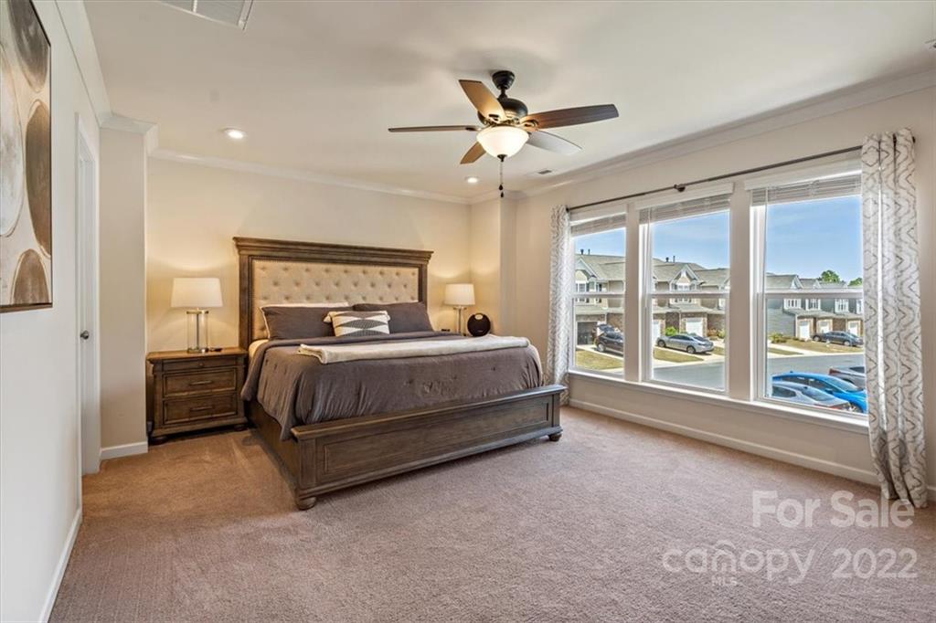 530 Hunters Dance Road Fort Mill, SC 29708 - Photo 22 of 35 a bedroom with a large bed and a large window