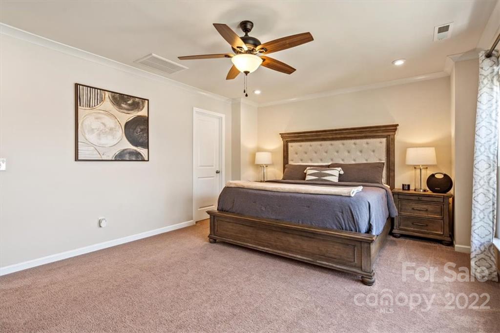 530 Hunters Dance Road Fort Mill, SC 29708 - Photo 23 of 35 a bedroom with a bed and dresser