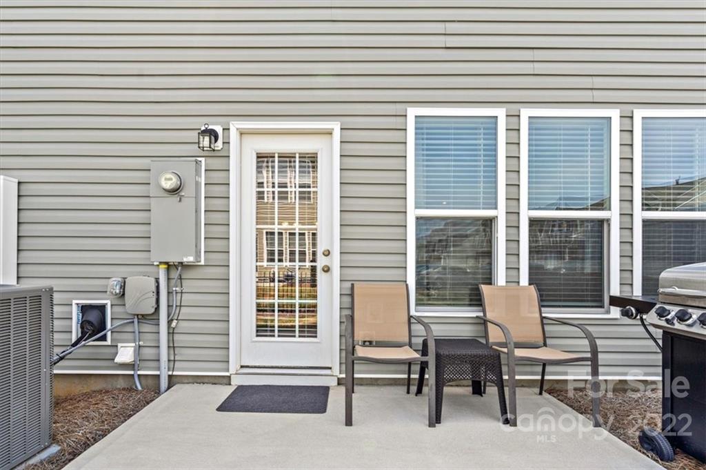 530 Hunters Dance Road Fort Mill, SC 29708 - Photo 35 of 35 a porch with a bench and chairs