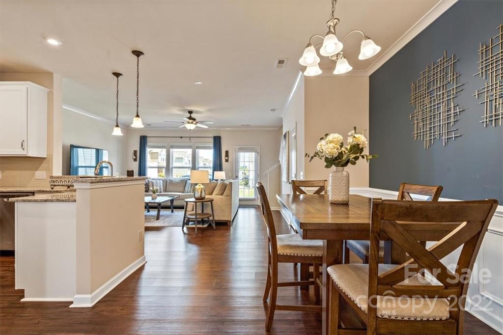 530 Hunters Dance Road Fort Mill, SC 29708 - Photo 7 of 35 a view of a dining room with furniture and wooden floor