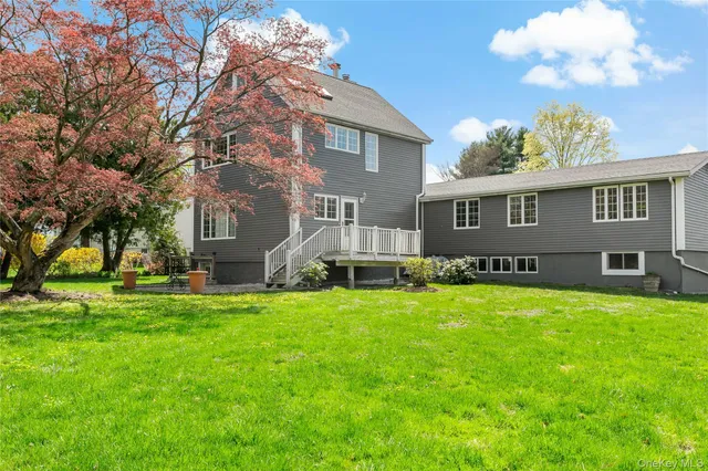 a front view of house with yard and trees