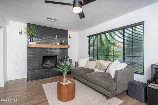 a living room with furniture and a fireplace