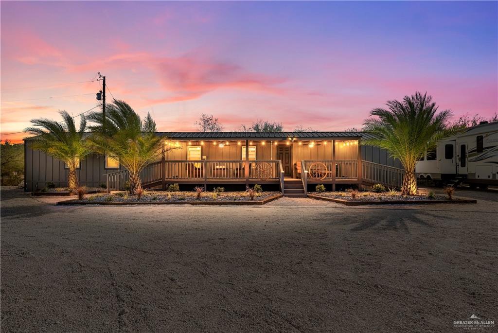 View of front of property with a porch and board and batten siding