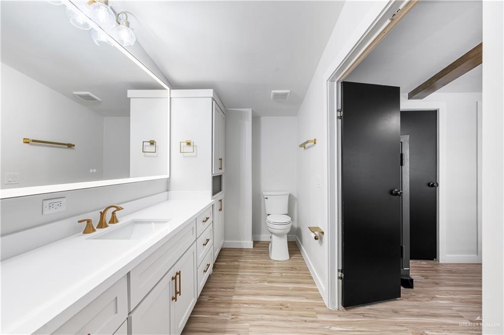 5501 Mile 8 1/2 Road Edinburg, TX 78541 - Photo 10 of 36 Bathroom with vanity and light wood finished floors
