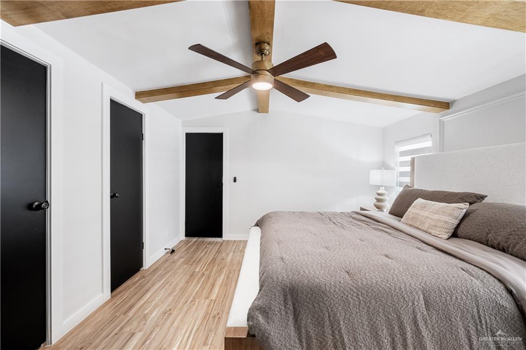5501 Mile 8 1/2 Road Edinburg, TX 78541 - Photo 13 of 36 Bedroom with beamed ceiling, light wood-type flooring, ceiling fan, and a closet