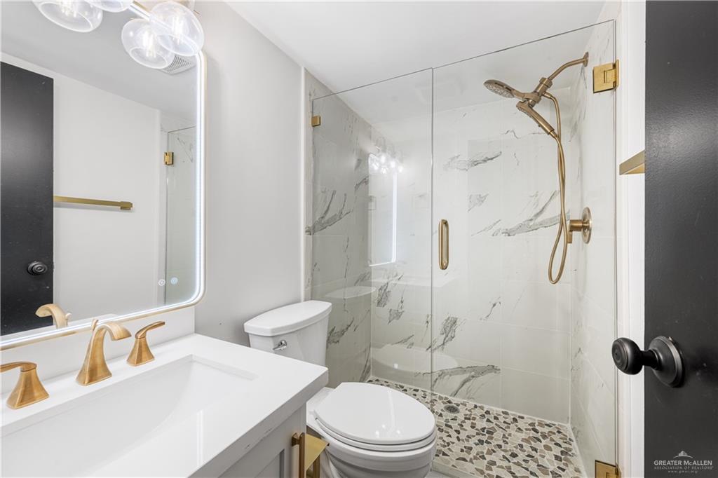 5501 Mile 8 1/2 Road Edinburg, TX 78541 - Photo 14 of 36 Bathroom with vanity and a marble finish shower