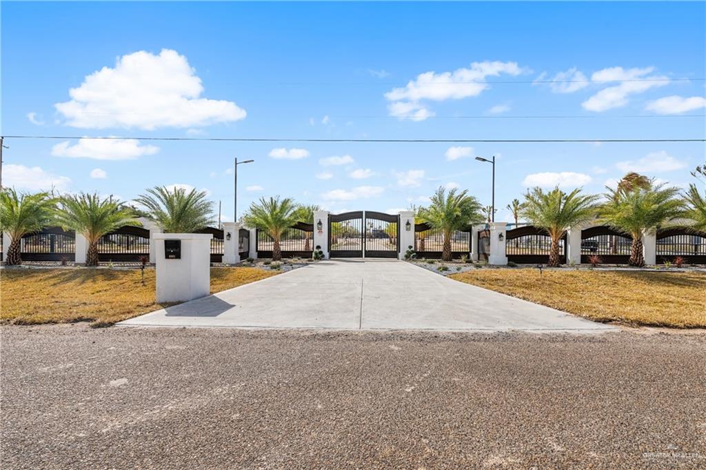 5501 Mile 8 1/2 Road Edinburg, TX 78541 - Photo 19 of 36 View of front of property with a gate and a fenced front yard