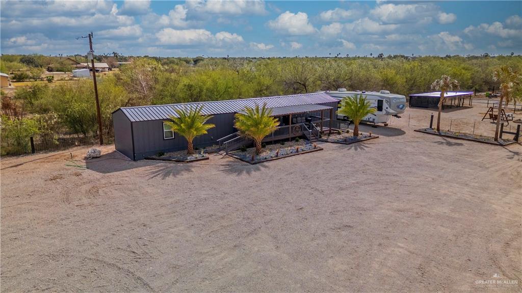 5501 Mile 8 1/2 Road Edinburg, TX 78541 - Photo 2 of 36 View of front of home featuring a metal roof