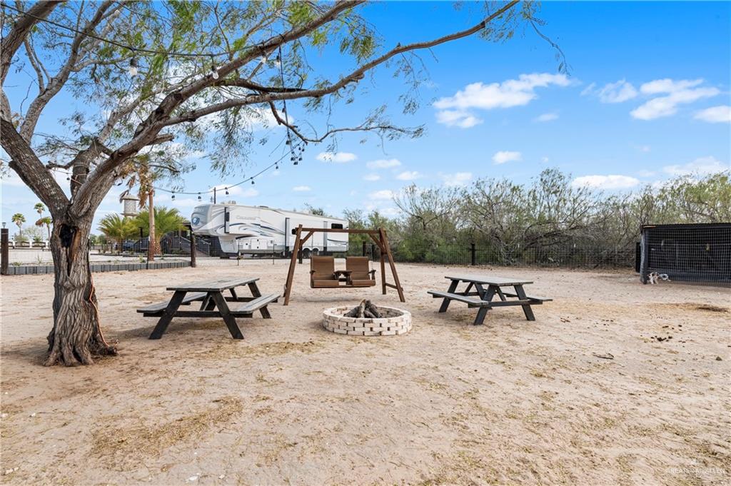 5501 Mile 8 1/2 Road Edinburg, TX 78541 - Photo 32 of 36 View of jungle gym featuring a fire pit