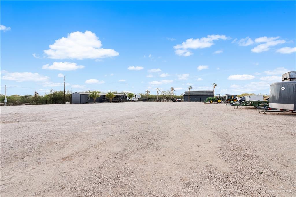 5501 Mile 8 1/2 Road Edinburg, TX 78541 - Photo 35 of 36 View of parking featuring a shed