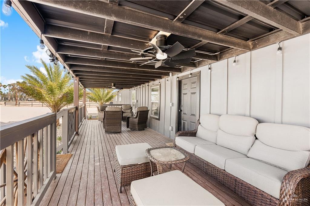 5501 Mile 8 1/2 Road Edinburg, TX 78541 - Photo 4 of 36 Wooden deck featuring outdoor seating and ceiling fan