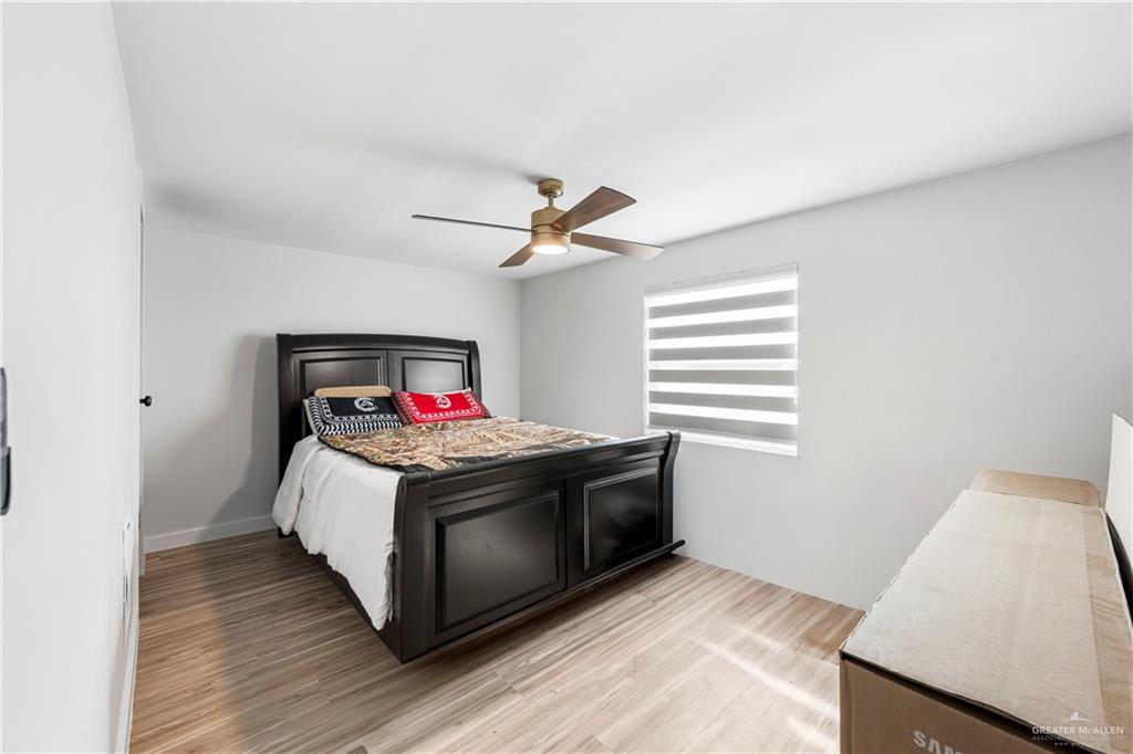 5501 Mile 8 1/2 Road Edinburg, TX 78541 - Photo 9 of 36 Bedroom featuring light wood-style flooring and a ceiling fan