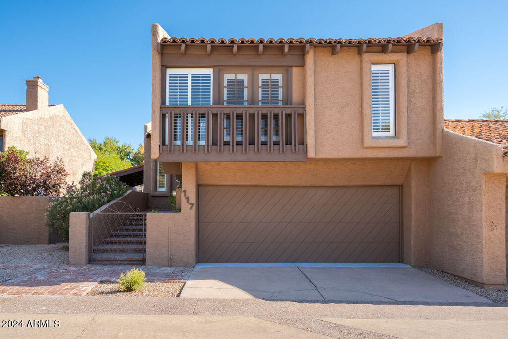 4432 East Camelback Road, Unit 117 Phoenix, AZ 85018 - Photo 1 of 1 a front view of a house with a yard