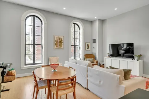 a kitchen with stainless steel appliances granite countertop a refrigerator a sink a stove a microwave and island