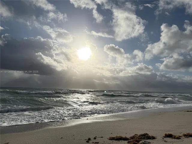 a living room with furniture a rug and a flat screen tv