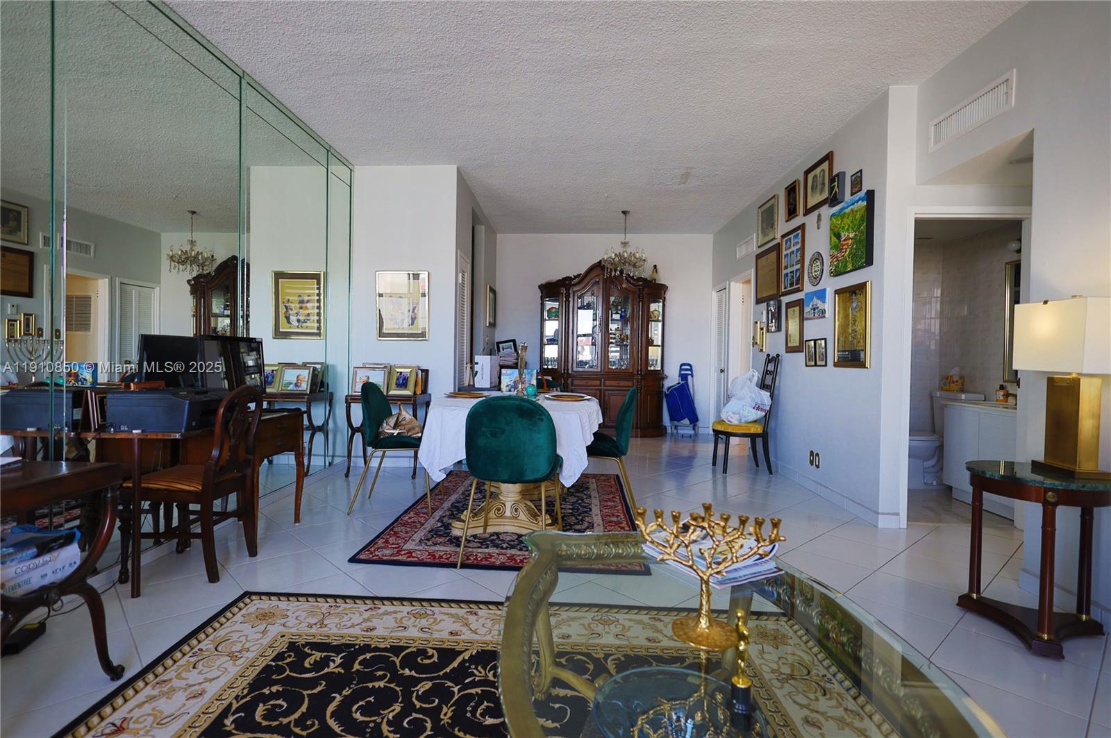 9225 Collins Avenue, Unit PHC Surfside, FL 33154 - Photo 33 of 33 a living room with furniture and wooden floor