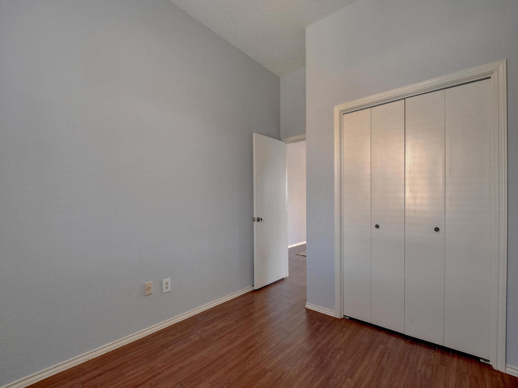 3019 Rochelle Drive Austin, TX 78748 - Photo 16 of 21 a view of an empty room with wooden floor