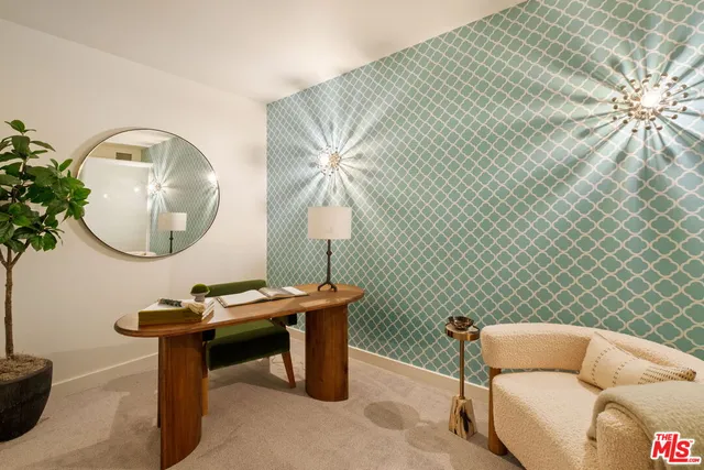 a living room with a table chairs and a chandelier