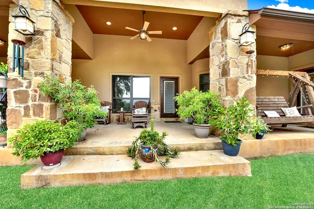a building outdoor space with patio furniture and garden