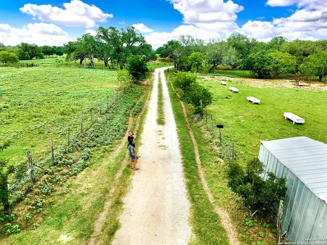 a view of a golf course with chairs
