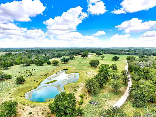 a view of a lake with a yard