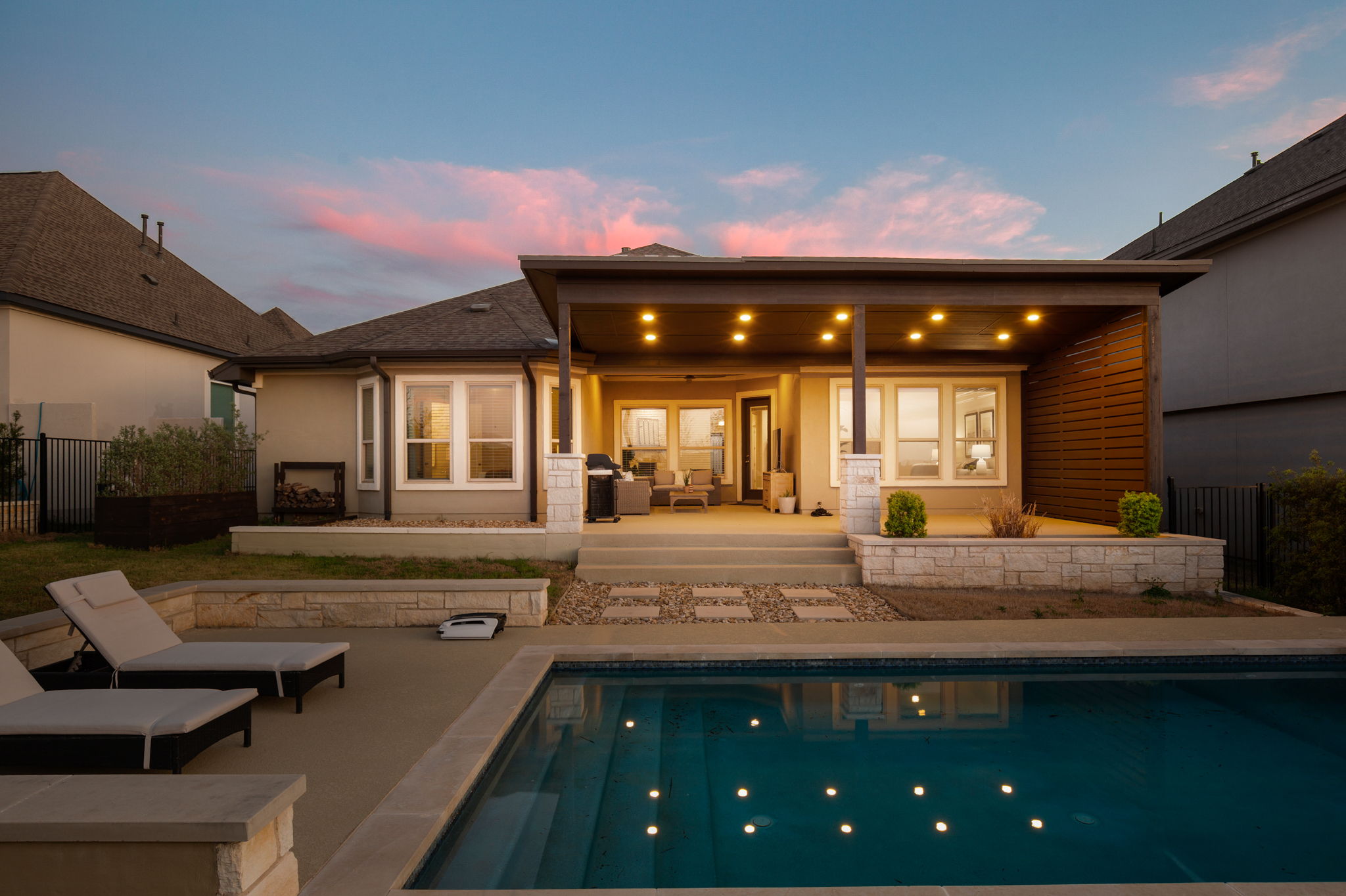 a view of a kitchen with stainless steel appliances granite countertop a sink and cabinets