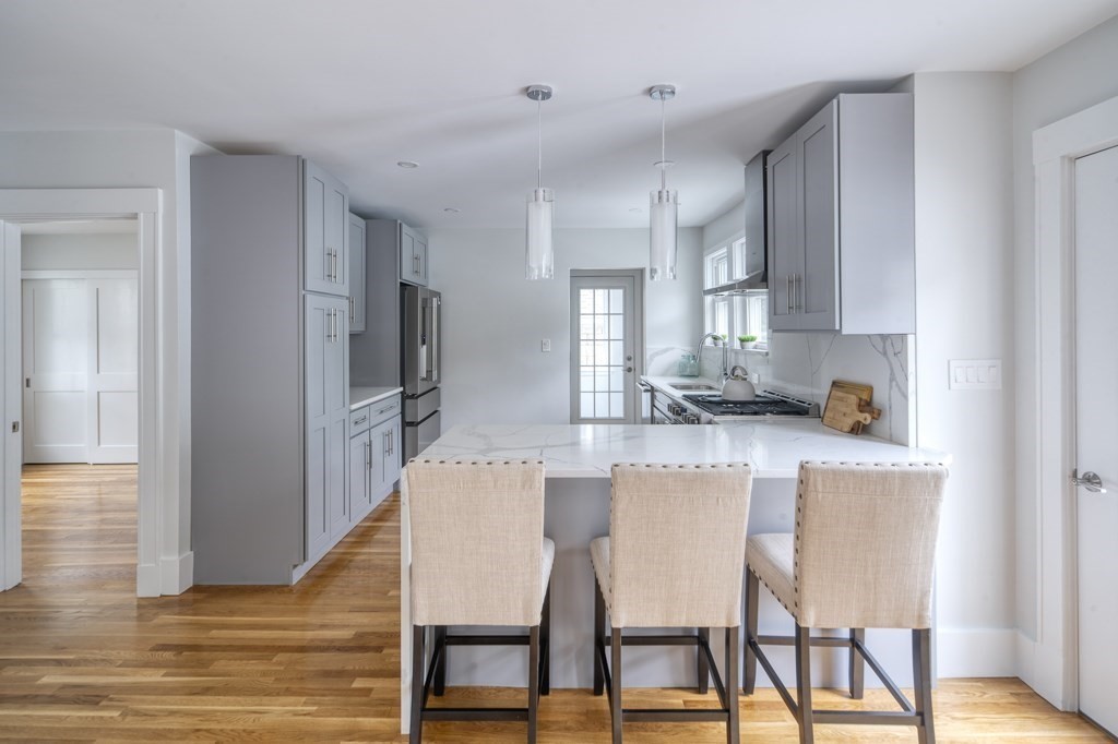 1 Mary Street, Unit 1 Arlington, MA 02474 - Photo 11 of 27 a dining room with furniture and wooden floor