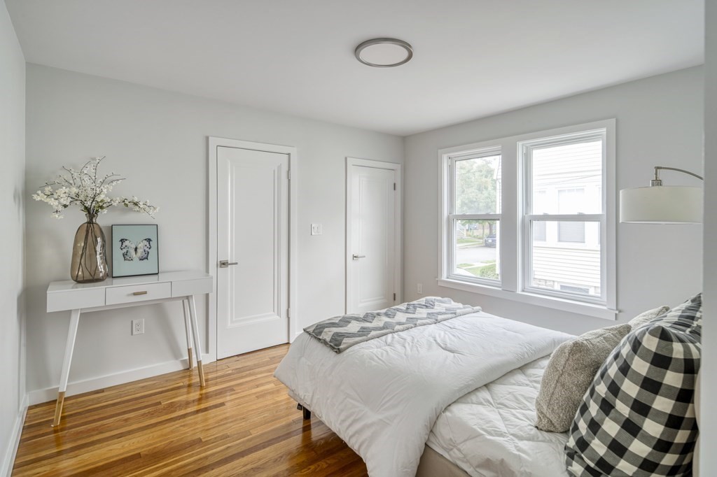 1 Mary Street, Unit 1 Arlington, MA 02474 - Photo 15 of 27 a bedroom with a bed and a window