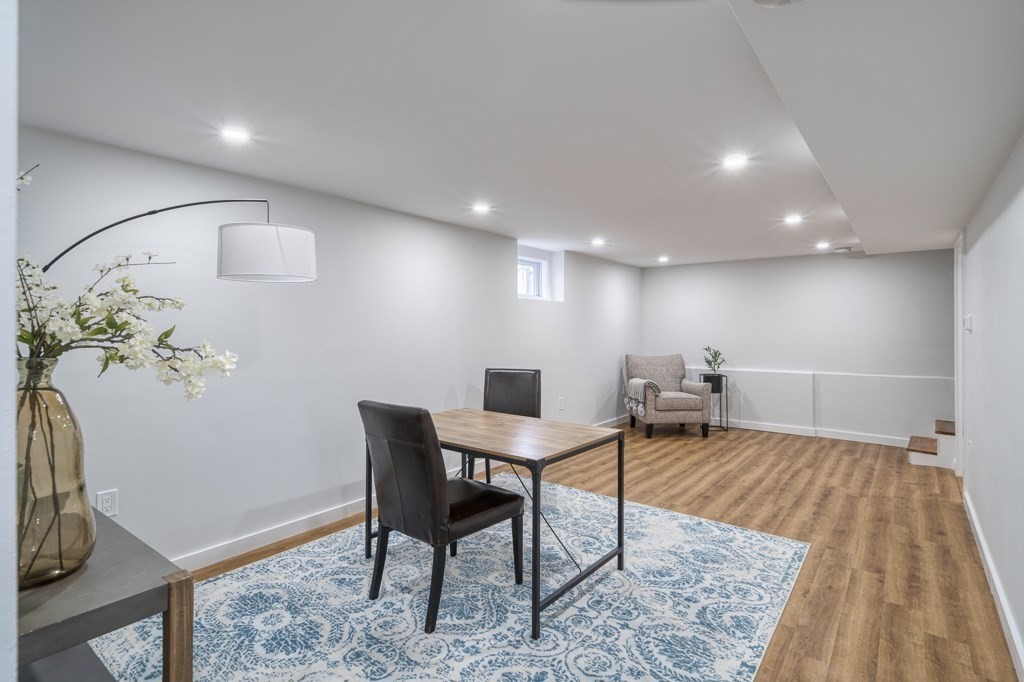 1 Mary Street, Unit 1 Arlington, MA 02474 - Photo 16 of 27 a workspace with furniture and wooden floor