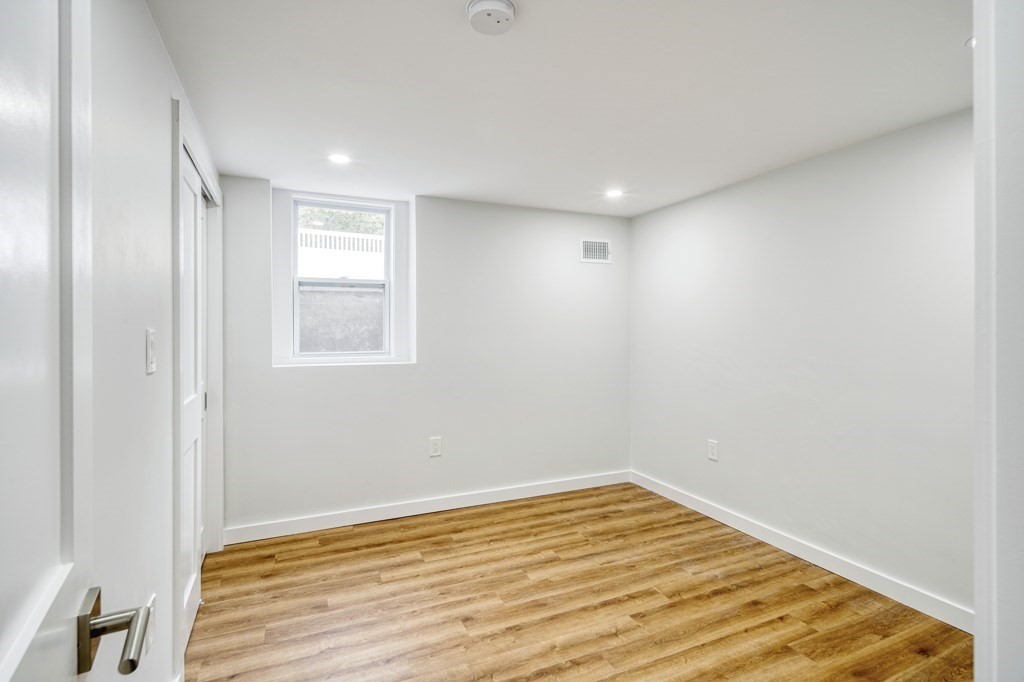 1 Mary Street, Unit 1 Arlington, MA 02474 - Photo 17 of 27 a view of empty room with wooden floor