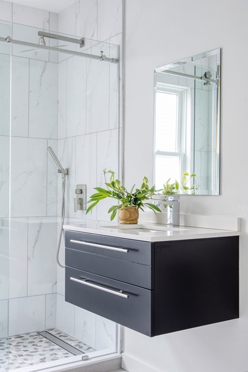 1 Mary Street, Unit 1 Arlington, MA 02474 - Photo 21 of 27 a bathroom with a sink and a bathtub