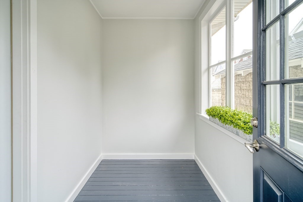 1 Mary Street, Unit 1 Arlington, MA 02474 - Photo 23 of 27 a view of an entryway with wooden floor and a potted plant