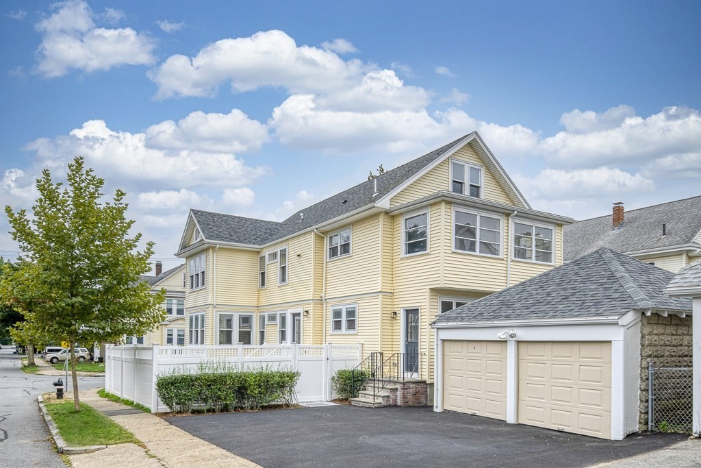 1 Mary Street, Unit 1 Arlington, MA 02474 - Photo 27 of 27 a front view of a house with garden
