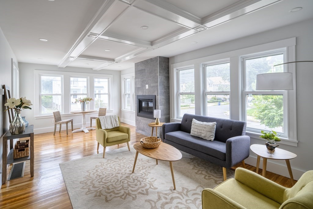 1 Mary Street, Unit 1 Arlington, MA 02474 - Photo 3 of 27 a living room with furniture and a large window