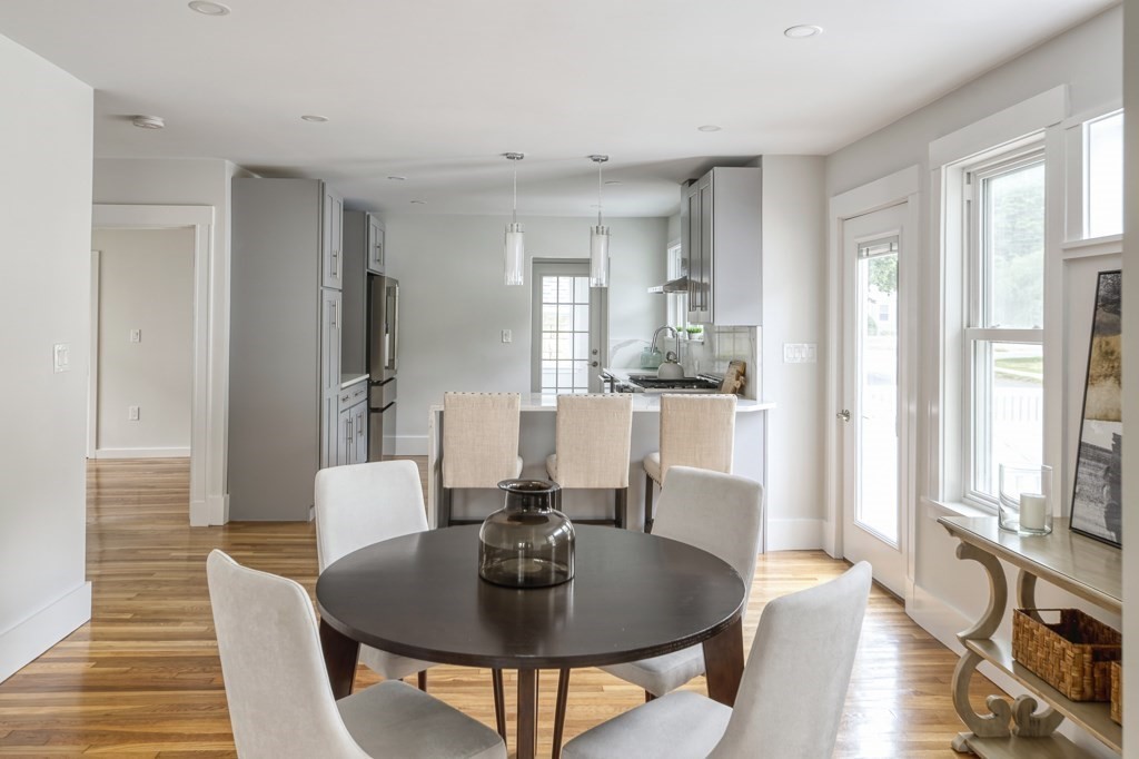 1 Mary Street, Unit 1 Arlington, MA 02474 - Photo 7 of 27 a view of a dining room with furniture and wooden floor