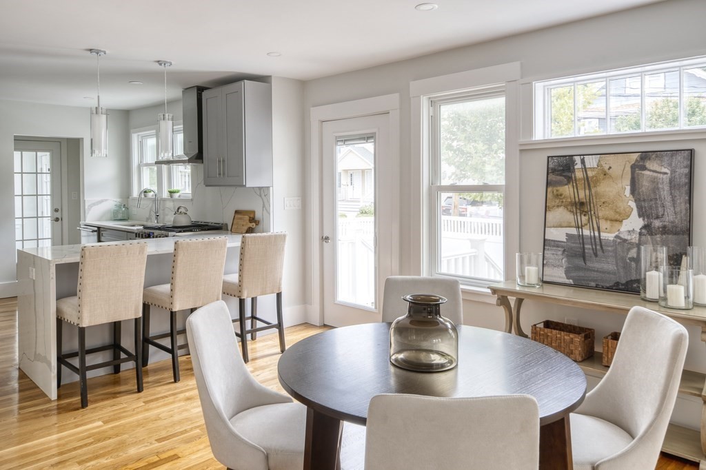 1 Mary Street, Unit 1 Arlington, MA 02474 - Photo 8 of 27 a dining room with furniture window and wooden floor
