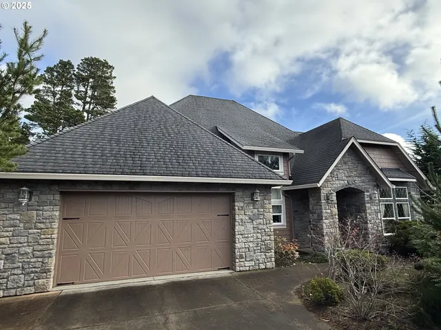 a front view of a house with a garage