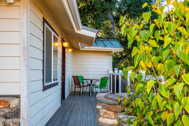 a view of backyard with patio and outdoor seating
