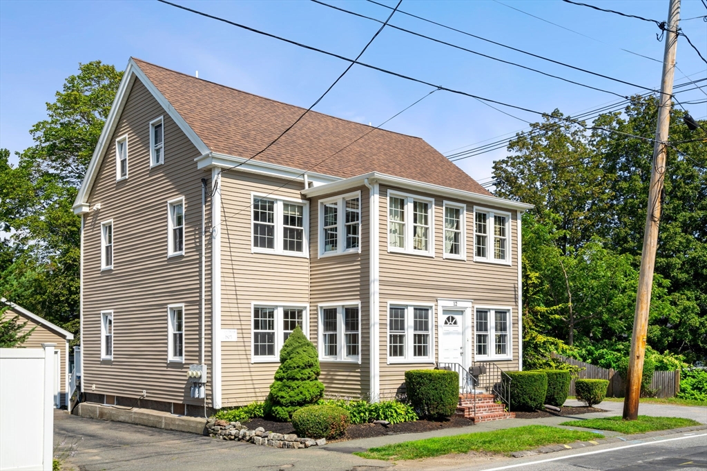 12 Chestnut Street Danvers, MA 01923 - Photo 35 of 37 a front view of a house with a yard
