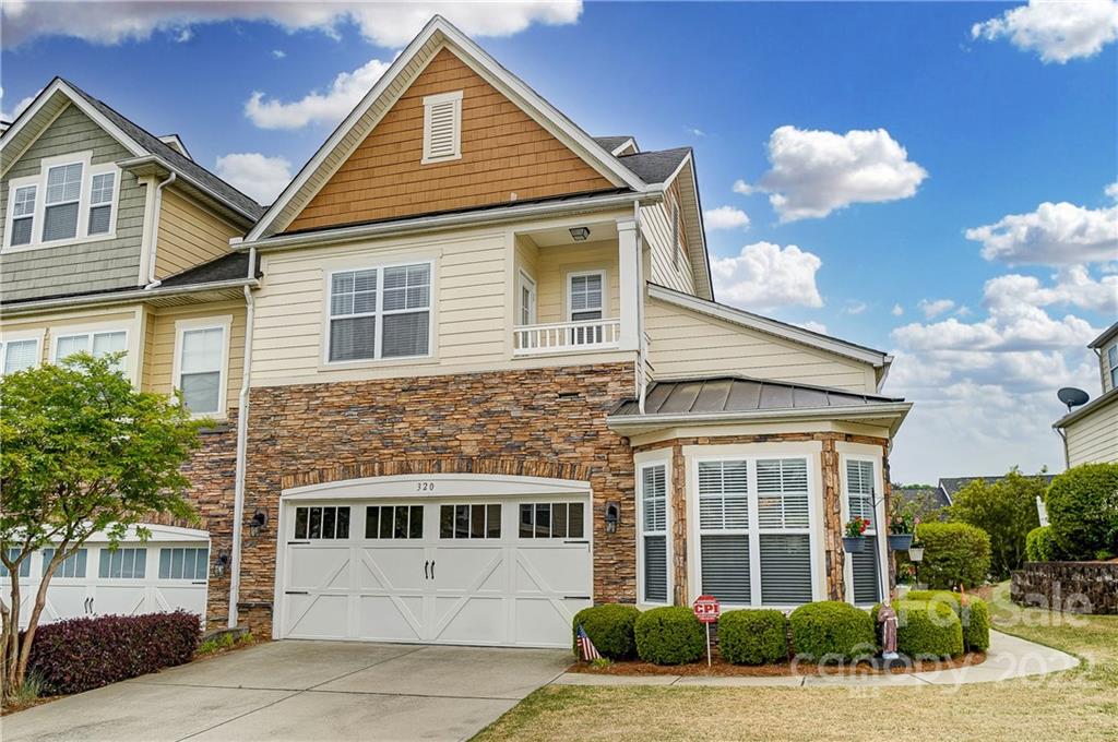 320 Wave Crest Drive Tega Cay, SC 29708 - Photo 1 of 46 a front view of a house with a yard