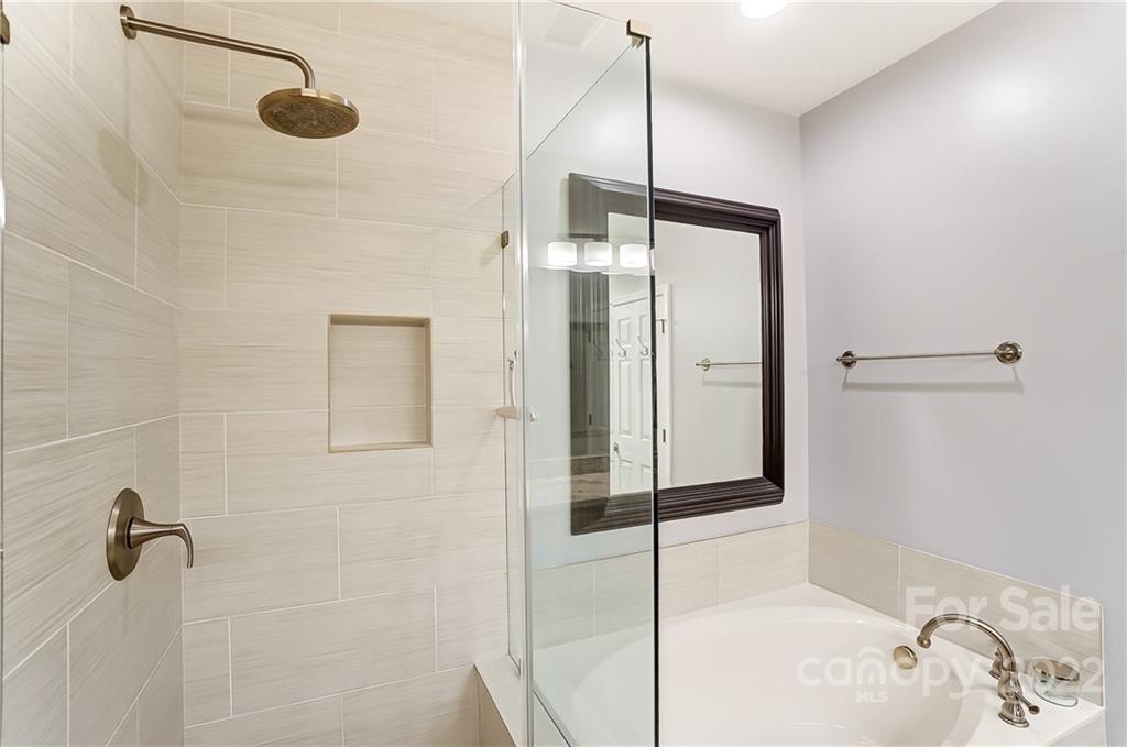 320 Wave Crest Drive Tega Cay, SC 29708 - Photo 26 of 46 a bathroom with a shower and a mirror