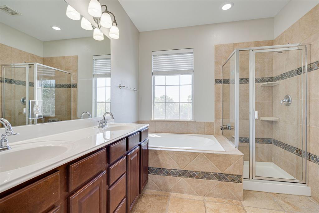 4016 Rome Court Irving, TX 75038 - Photo 8 of 24 Master Bathroom features separate shower and garden tub.
