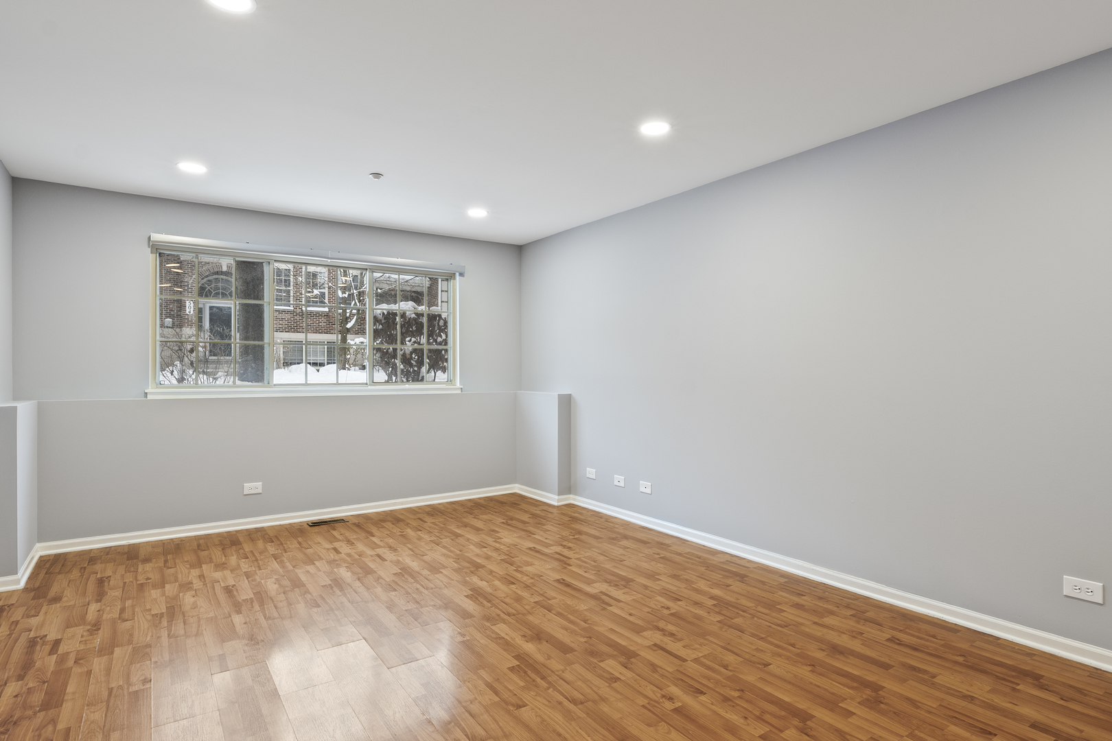 484 Prestwick Lane Wheeling, IL 60090 - Photo 25 of 36 a view of an empty room with wooden floor and a window