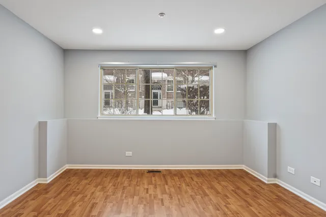 a view of a wooden fence and a yard