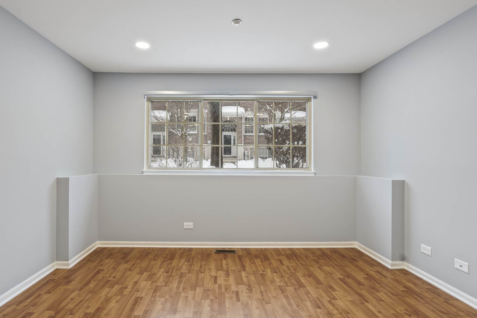 484 Prestwick Lane Wheeling, IL 60090 - Photo 28 of 36 an empty room with wooden floor and windows