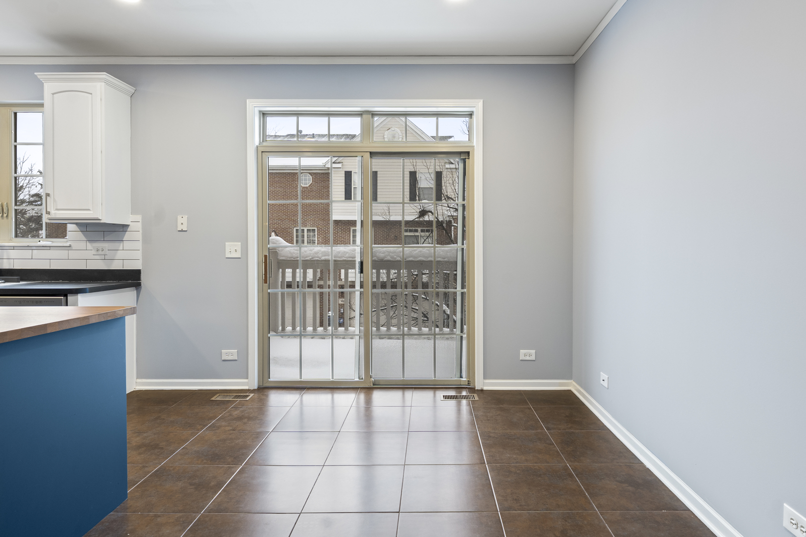 484 Prestwick Lane Wheeling, IL 60090 - Photo 10 of 36 a view of a kitchen with an empty space and a window