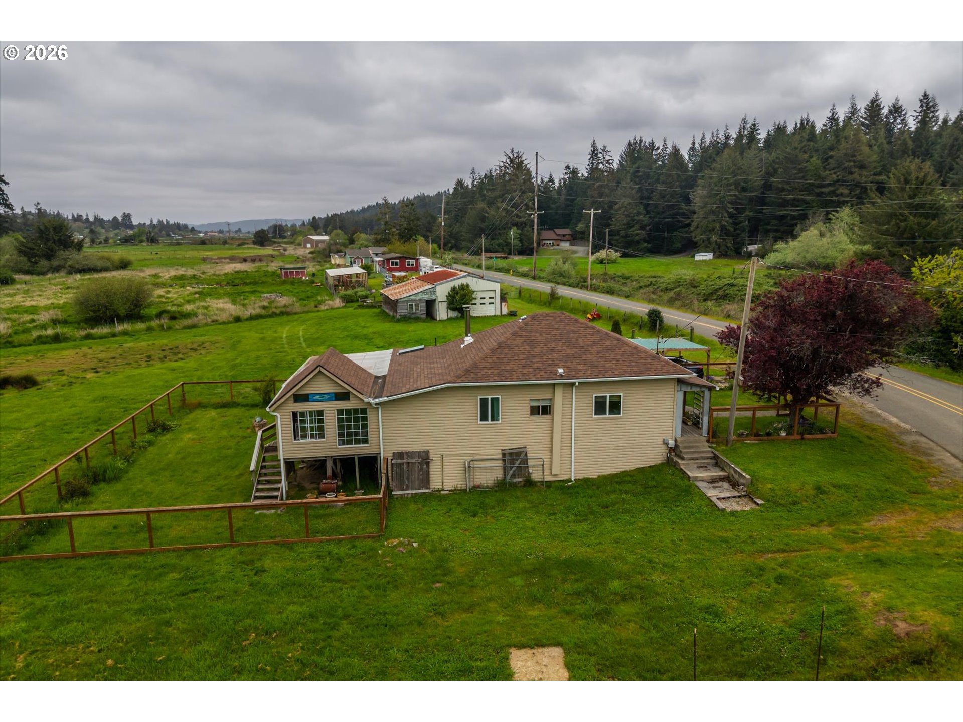 63008 Red Dyke Road Coos Bay, OR 97420 - Photo 11 of 18 a aerial view of a house with garden and trees