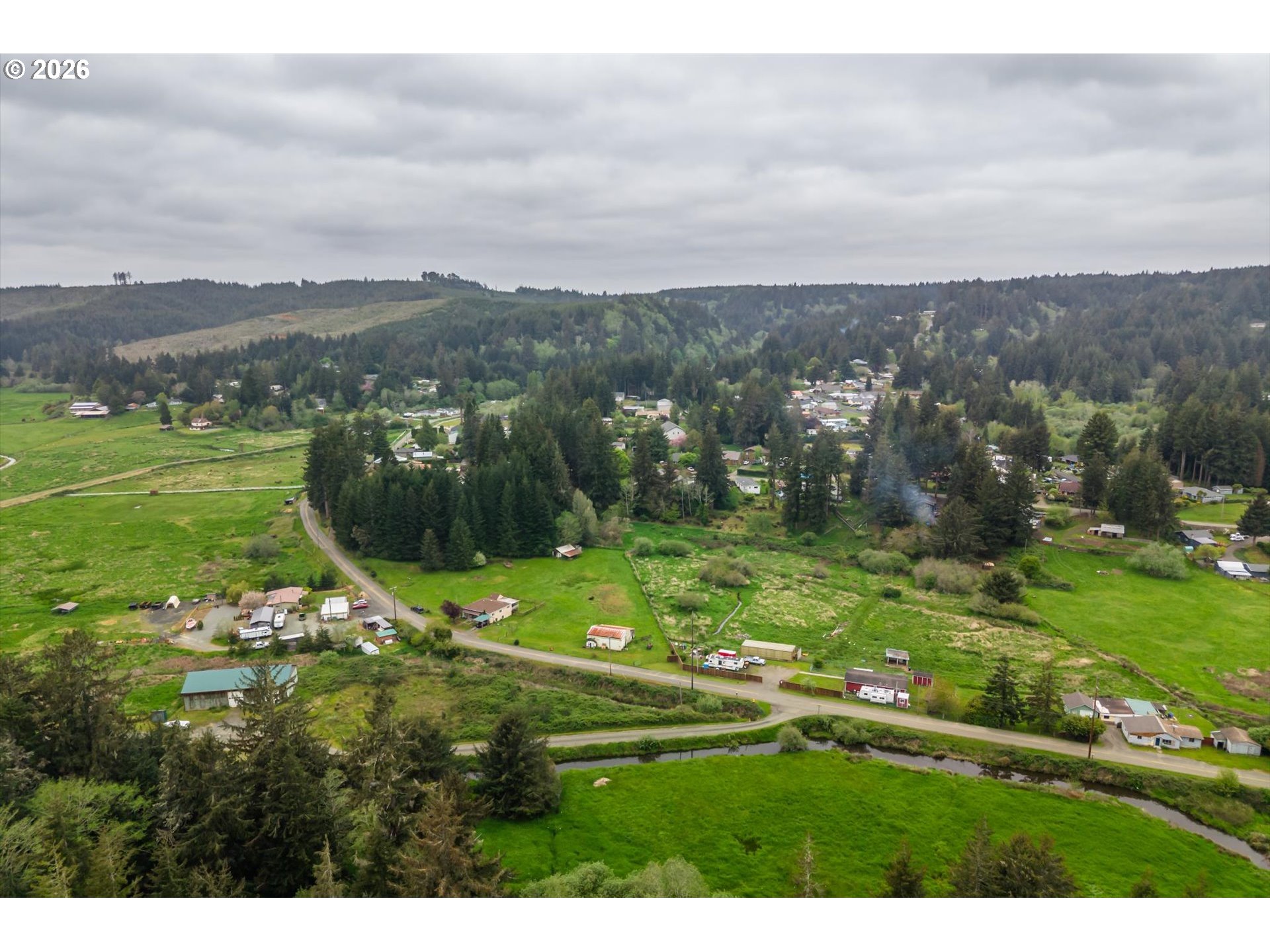 63008 Red Dyke Road Coos Bay, OR 97420 - Photo 13 of 18 a view of a town with mountains in the background