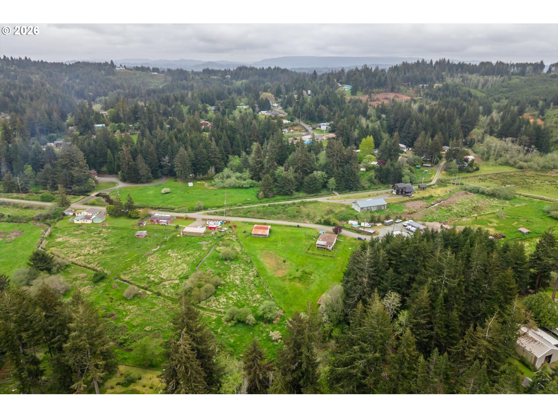 63008 Red Dyke Road Coos Bay, OR 97420 - Photo 14 of 18 a view of field with trees in the background