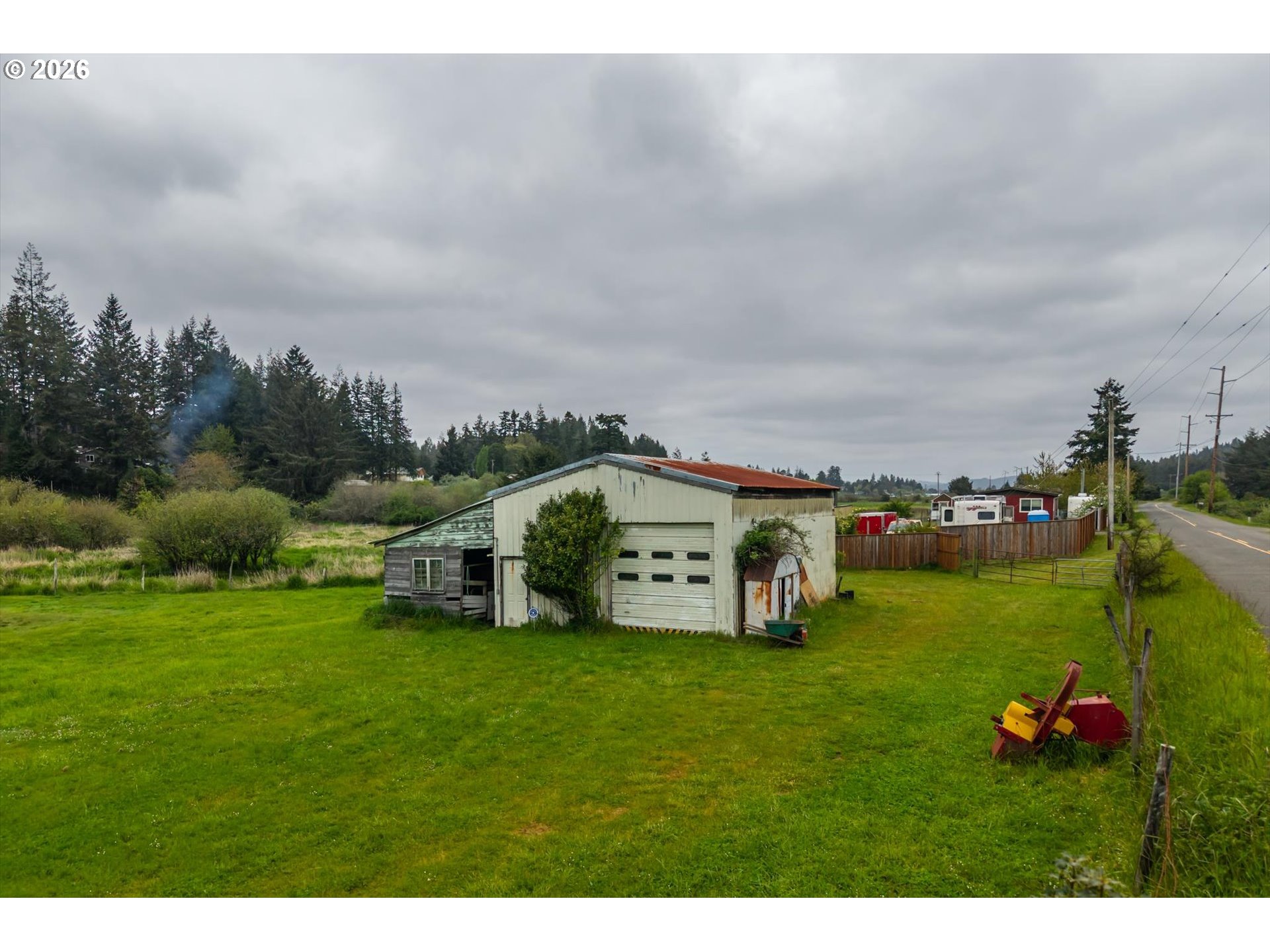 63008 Red Dyke Road Coos Bay, OR 97420 - Photo 15 of 18 a view of a house with a big yard and large trees